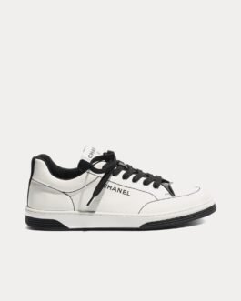 Baskets basses Chanel en coton blanc/noir