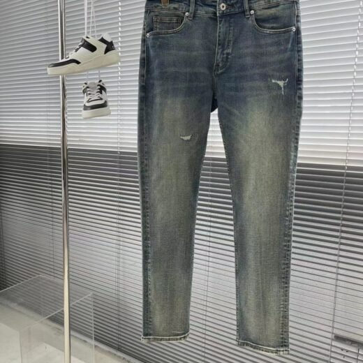 Prada Jean long en denim robuste délavé dégradé pour homme