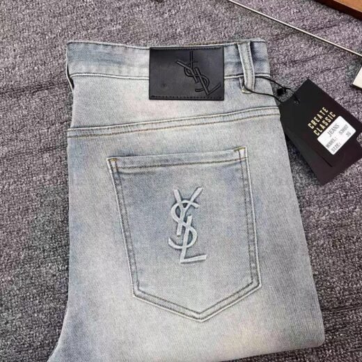 Versace YSL Jean élégant avec monogramme brodé
