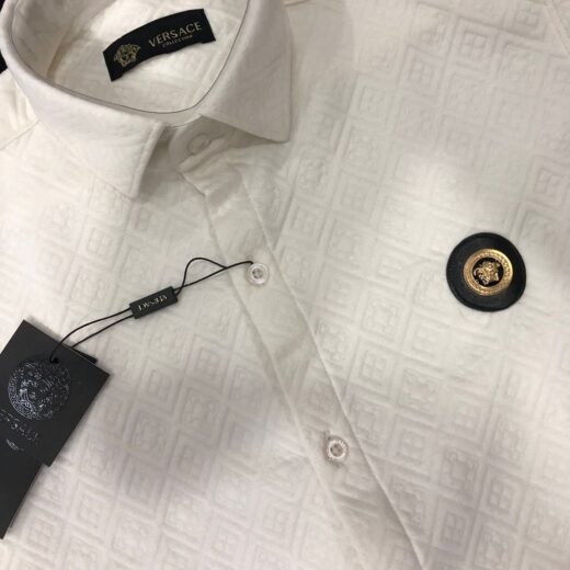 Versace Chemise à manches longues en coton et lycra imprimé monogramme