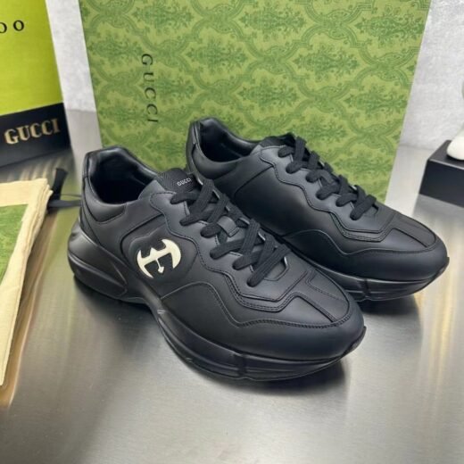GUCCI / Baskets Rhyton noires à G entrelacés – UK-7