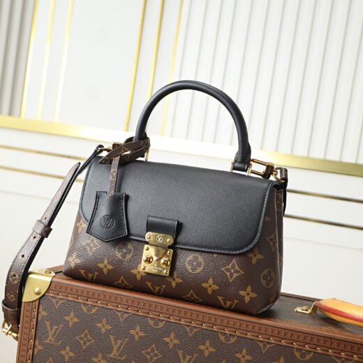 Louis Vuitton Sac à main Madeleine BB en toile Monogram et cuir noir